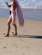 woman on beach with turkish towel portsea blush