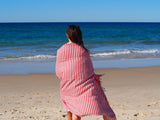 woman on beach with turkish towel portsea cherry