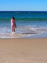 woman on beach with turkish towel portsea cherry