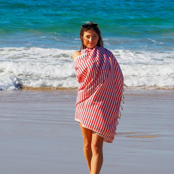 woman on beach with turkish towel portsea cherry