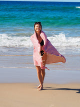 woman on beach with turkish towel portsea cherry