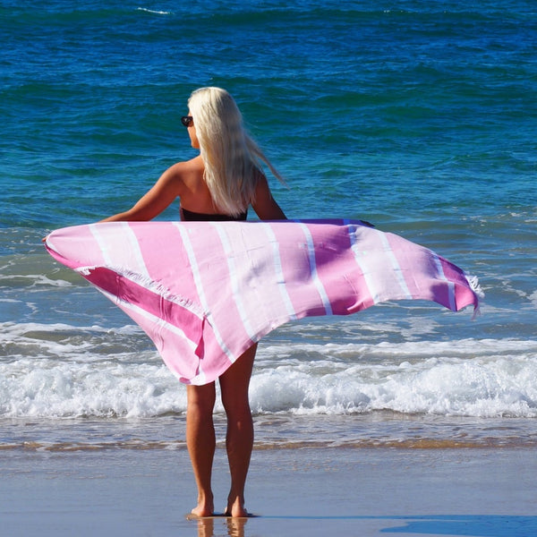 woman on beach with SORRENTO TURKISH COTTON TOWEL - CANDY