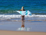 woman with SORRENTO TURKISH COTTON TOWEL - OCEAN