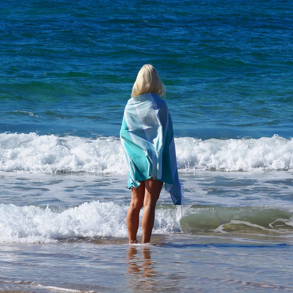 woman with SORRENTO TURKISH COTTON TOWEL - OCEAN