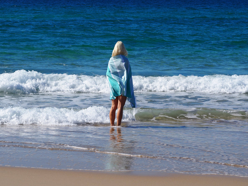 woman with SORRENTO TURKISH COTTON TOWEL - OCEAN