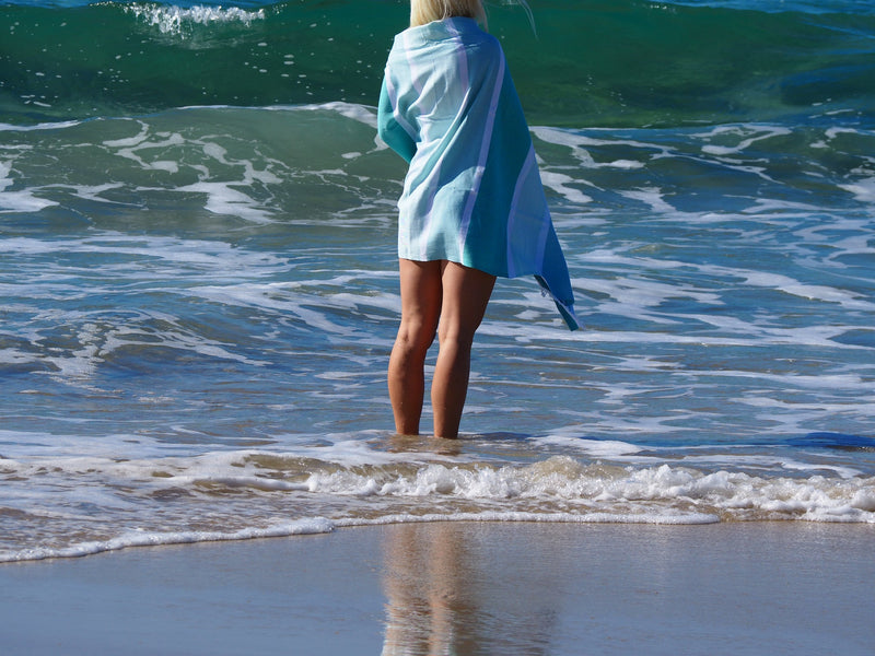 woman with SORRENTO TURKISH COTTON TOWEL - OCEAN